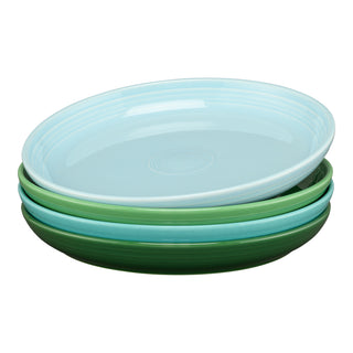 The Fiesta Mixed Aegean Coupe 10 3/8 Inch Dinner Bowls, 40 OZ, Set of 4 in shades of blue and green create a stylish table setting when paired together.