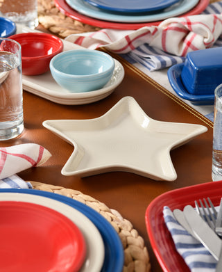 The Fiesta Star Plate, a cream-colored star-shaped dish crafted from lead-safe china, is a festive addition to your table and makes a perfect hostess gift.