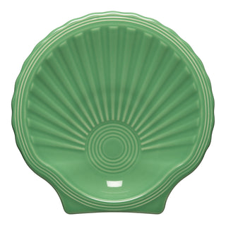 The Fiesta Retired Shell Shaped Plate 8 1/4 OZ in meadow is a green ceramic plate with scallop shell design, radial ridges, and glossy finish. This lead-safe china is proudly made in the USA.