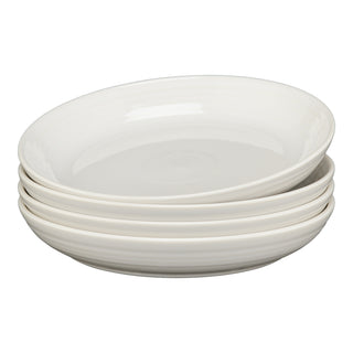 A set of four Fiesta White Coupe 8 1/2 Inch Luncheon Bowls (26 oz) creates a cohesive tablescape, neatly arranged against a plain white background.