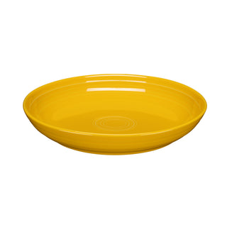 The Fiesta Coupe 8 1/2 Inch Luncheon Bowl, in vibrant daffodil, holds 26 oz and features a glossy finish with concentric circles—ideal for adding colorful style to your bowl collection.