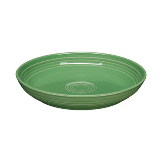 The Fiesta Coupe 8 1/2 Inch Luncheon Bowl in meadow is a round, shallow, green ceramic bowl with concentric inner ridges and a glossy finish—perfect for stylish, multipurpose use. Shown on a white background and holds 26 oz.