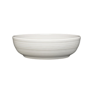 The Fiesta Coupe 6 3/4 Inch Salad Bowl, 24 OZ in white, features a smooth, round ceramic design with subtle horizontal ridges and is dishwasher safe for easy cleaning. Shown on a white background.