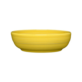 The Fiesta Coupe 6 3/4 Inch Salad Bowl (24 OZ) in sunflower features a smooth, glossy finish. This ceramic bowl is dishwasher safe and displayed on a white background.