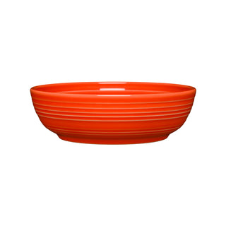 The Fiesta Coupe 6 3/4 Inch Salad Bowl (24 oz) in poppy features a glossy finish, smooth interior, and horizontal side ridges. This ceramic bowl is dishwasher safe and shown against a plain white background.
