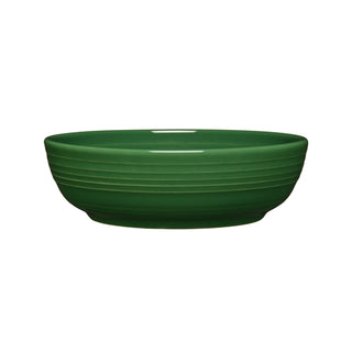 The Fiesta Coupe 6 3/4 Inch Salad Bowl in jade features a glossy finish with subtle horizontal ridges. This 24 oz ceramic bowl, shown against a white background, is dishwasher safe for easy cleaning.