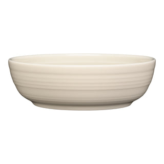 The Fiesta Linen Coupe 6 3/4 Inch Salad Bowl (24 OZ) features a plain off-white ceramic design with subtle horizontal ridges; it's stylish, dishwasher safe, and shown against a white background.