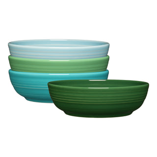 The Fiesta Mixed Aegean Coupe 6 3/4 Inch Salad Bowl Set includes four 24 OZ ceramic bowls in coordinated hues, each with a ridged design—ideal for adding chic style to your table.