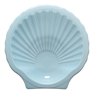 The Fiesta Retired Shell Shaped Plate, 8 1/4 inch in sky, features ridged lines and a glossy finish—an ocean-inspired piece for your table.