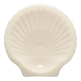 The Fiesta Retired Shell Shaped Plate, 8 1/4 inch in Linen, features ceramic construction and ridged details with a smooth, glossy finish—an elegant addition to any coastal-inspired collection.