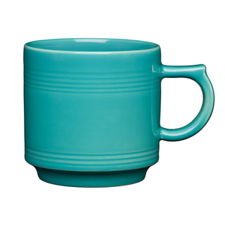 The Fiesta 16 OZ Stackable Mug by Fiesta, in turquoise with a rounded handle, subtle horizontal ridges, and a glossy finish, is perfect for your coffee bar setup and shown against a white background.
