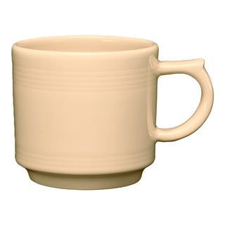 The Retired Fiesta 16 OZ Stackable Mug by Fiesta features an ivory color, a large handle, and subtle horizontal ridges near the top. Made from lead-safe china, this ceramic mug is shown against a white background.