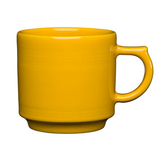 The Fiesta 16 OZ Stackable Mug by Fiesta, in a vibrant daffodil color, features a rounded body and sturdy handle—ideal for your coffee bar setup—displayed against a white background.