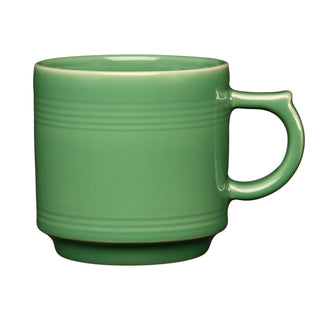 The Fiesta 16 OZ Stackable Mug by Fiesta, shown in meadow green with a large handle and subtle horizontal ridges near the top, is perfect for a coffee bar setup and displayed against a plain white background.