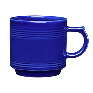 The Fiesta 16 OZ Stackable Mug by Fiesta in twilight features a rounded handle and embossed horizontal lines, perfect for a coffee bar setup. Shown against a white background.