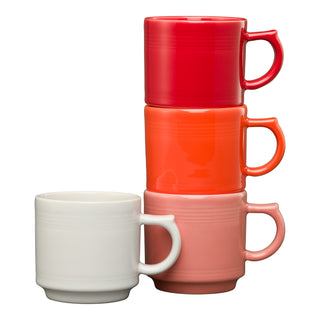 The image features the Fiesta Retired Sunset Horizon 16 OZ Set of 4 Mixed Stackable Mug Set—three colorful stackable mugs in red, orange, and pink, plus a white mug, all showcasing a simple horizontal line design.
