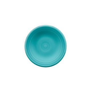 A turquoise Retired Fiesta 3 Inch Magnet Mini Dinner Plate by Fiesta is shown from above on a white background, featuring a smooth, glossy finish with subtle concentric circles.