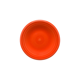 A poppy-colored Retired Fiesta 3 Inch Magnet Mini Dinner Plate by Fiesta, inspired by classic dinner plate designs, features concentric circular patterns and is made in the USA.