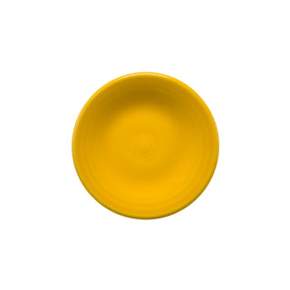 A daffodil-colored Retired Fiesta 3 Inch Magnet Mini Dinner Plate by Fiesta, round and ceramic, is photographed from above against a plain white background.