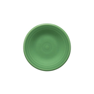 A round, meadow green Retired Fiesta 3 Inch Magnet Mini Dinner Plate by Fiesta, featuring a subtle raised circular pattern and classic design—seen from above on a white background. Made in the USA.