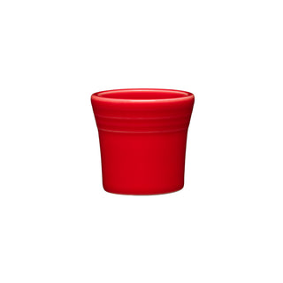 A Fiesta 1 1/2 OZ Ceramic Shot Glass in Scarlet, featuring smooth sides and two subtle ridges near the rim, is made in the USA, dishwasher safe, and centered on a plain white background.