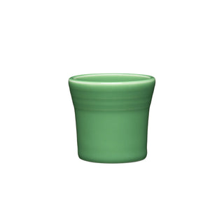 The Fiesta 1 1/2 OZ Ceramic Shot Glass by Fiesta, in meadow green, features slightly flared sides and a smooth, glossy finish. Made in the USA, this compact cup is displayed against a white background.