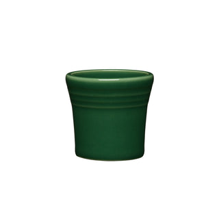 The Fiesta 1 1/2 OZ Ceramic Shot Glass by Fiesta is a small, jade-colored cup with a slightly flared rim and three grooves near the top, made in the USA and shown against a plain white background.
