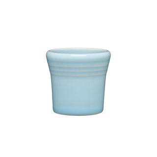 The Fiesta 1 1/2 OZ Ceramic Shot Glass by Fiesta features a small, sky-colored design with subtle horizontal ridges near the top, a smooth surface, made in the USA, dishwasher safe, shown on a plain white background.