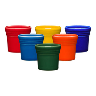 Six Fiesta 1 1/2 OZ Ceramic Shot Glasses by Fiesta, made in the USA, are shown in two rows on a white background. The glossy shot glasses come in red, yellow, blue, green, orange, and dark blue with slightly flared rims.