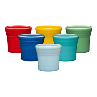 The Fiesta Vibrant 1 1/2 OZ Mixed Colors 6pc Ceramic Shot Glass Set features six colorful shot glasses—blue, light blue, turquoise in front; red, yellow, green in back—arranged in two rows on a white background.
