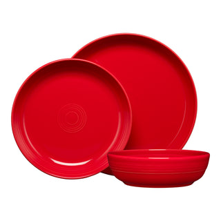 The Fiesta Coupe Bowl 3-Piece Place Setting includes two plates (large and medium) and a shallow bowl, all crafted from lead-safe china with a glossy finish and subtle concentric circles for a vibrant dining experience.