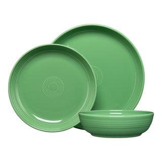 The Fiesta Coupe Bowl 3-Piece Place Setting includes two green ceramic plates in different sizes with concentric circle designs and a matching coupe bowl. All pieces are crafted from lead-safe china and shown against a white background.