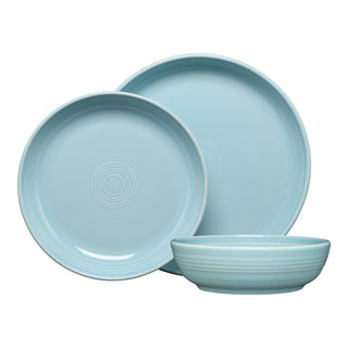The Fiesta Coupe Bowl 3-Piece Place Setting includes two light blue ceramic plates in different sizes with a concentric circle design and a matching coupe bowl, all featuring a glossy, lead-safe china finish—ideal for an elegant table.