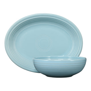The Fiesta 2-Piece Serve Set, featuring an 11 5/8" oval platter and a 38 oz bistro bowl in sky, offers elegant embossed concentric rings and style—perfect for showcasing timeless dinnerware against a white background.