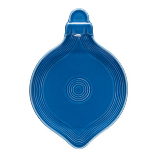 The Fiesta 8 3/4 Inch Ornament Shaped Plate in Lapis features a rounded, decorative design with concentric circles, ideal as a festive holiday table accent or unique spoon rest.