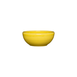 The Fiesta 3 3/4 Inch Mini Bowl (5 oz) by Fiesta in sunflower color, featuring a smooth ceramic surface, is centered on a white background.