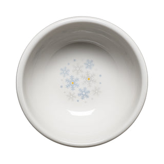 The Fiesta White Snowflakes 3 3/4 Inch Mini Bowl (5 oz) showcases a charming design with light blue and gray snowflakes accented by two small yellow dots at the interior center—making it an ideal choice for holiday entertaining.