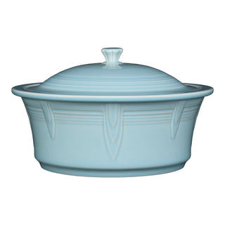 The Fiesta Large 10 Inch Round Covered Casserole (2.8 Quart) in sky features a matching lid with a knob handle and subtle embossed patterns, made in the USA, displayed on a white background.