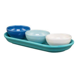 The Fiesta Coastal Blues Mixed Colors 4-Piece Condiment Set features three glossy bowls in blue tones and white, arranged on a matching turquoise tray, shown against a white background.