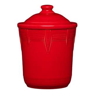 The Retired Fiesta 1 Quart Small Chevron Canister by Fiesta, shown in scarlet with a matching lid and vertical ridges, provides vibrant kitchen storage and is displayed against a white background.