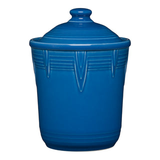 The Retired Fiesta 1 Quart Small Chevron Canister by Fiesta features a lapis blue finish and matching lid, with raised geometric patterns and horizontal lines for style. Its airtight design keeps kitchen items fresh and secure.