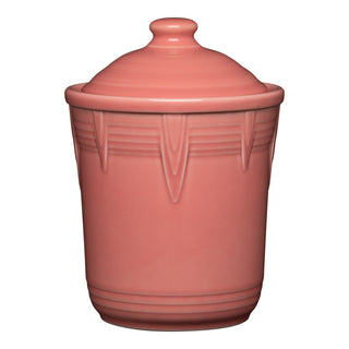 The retired Fiesta 1 Quart Small Chevron Canister in peony features an art deco-inspired design with horizontal ridges and a matching lid, offering airtight, colorful kitchen storage from Fiesta.