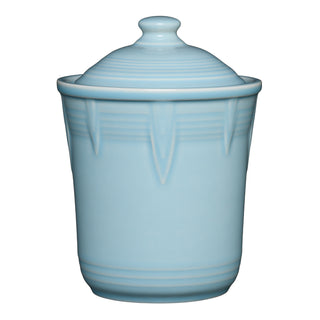 The Retired Fiesta 1 Quart Small Chevron Canister in sky features an airtight lid with a rounded knob and subtle chevron embossing—ideal for colorful kitchen storage while keeping contents fresh.