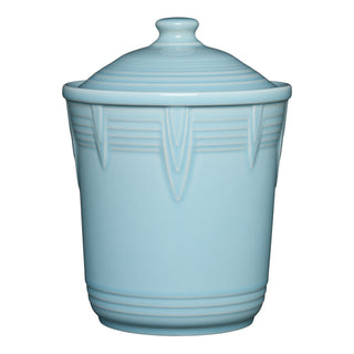 The Retired Fiesta 2 Quart Medium Chevron Canister in sky features vertical geometric and horizontal line accents, an airtight lid with a round handle, and is perfect for colorful kitchen storage. Brand: Fiesta. Background is white.
