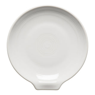 The Fiesta Extra Large Spoon Rest 7 Inch in white is a round ceramic plate with a small handle and subtle concentric ridges, ideal as a stylish kitchen utensil holder.