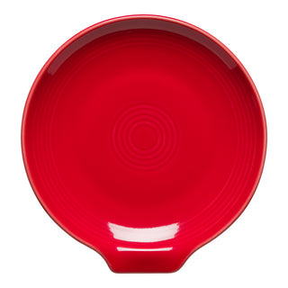The Fiesta Extra Large Spoon Rest (7 Inch) in Scarlet features a round design with a tab handle and concentric circles, shown from above on a white background—ideal as a kitchen utensil holder.