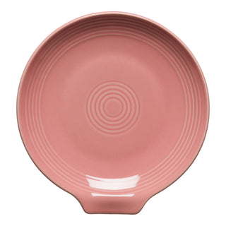 This Fiesta Retired Extra Large Spoon Rest, 7-inch in Peony, features a round pink ceramic design with concentric circles and a small handle extension—perfect as an oversized spoon rest or utensil holder.