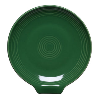The Fiesta Extra Large Spoon Rest 7 Inch in Jade is a round, dark green ceramic piece with a glossy finish, concentric circle patterns, and a small tab handle—perfect for keeping your countertop clean.