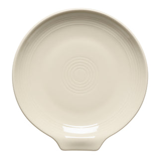 The Fiesta Extra Large Spoon Rest 7 Inch in Linen features a round, cream design with concentric circles and a flat handle—perfect for holding kitchen utensils in style.