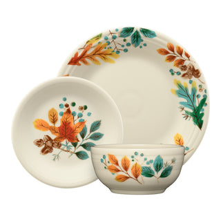 The Fiesta Autumn Fields Classic Bistro Coupe 3-Piece Place Setting includes a bowl, small plate, and large plate, each featuring autumn leaf and berry designs in orange, yellow, teal, and brown. Stylish and dishwasher safe.